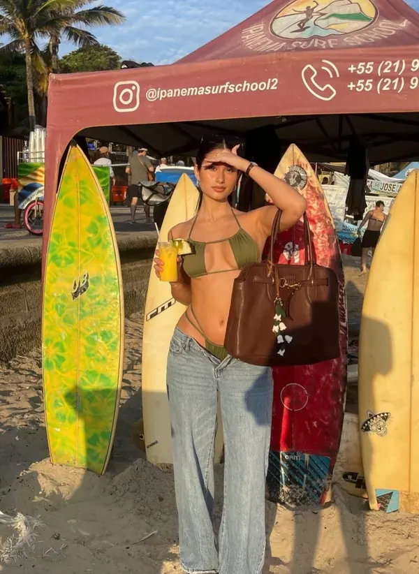 Bali-Lú customer: bikini top and jeans at a surf school