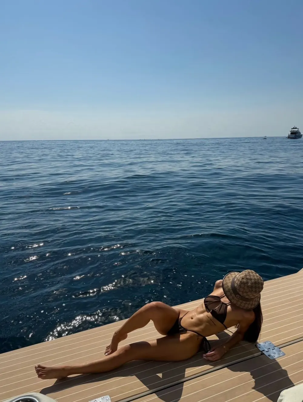 Brown bikini on the boat deck